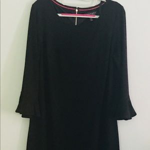 Black dress with 3/4 bell style sleeves.